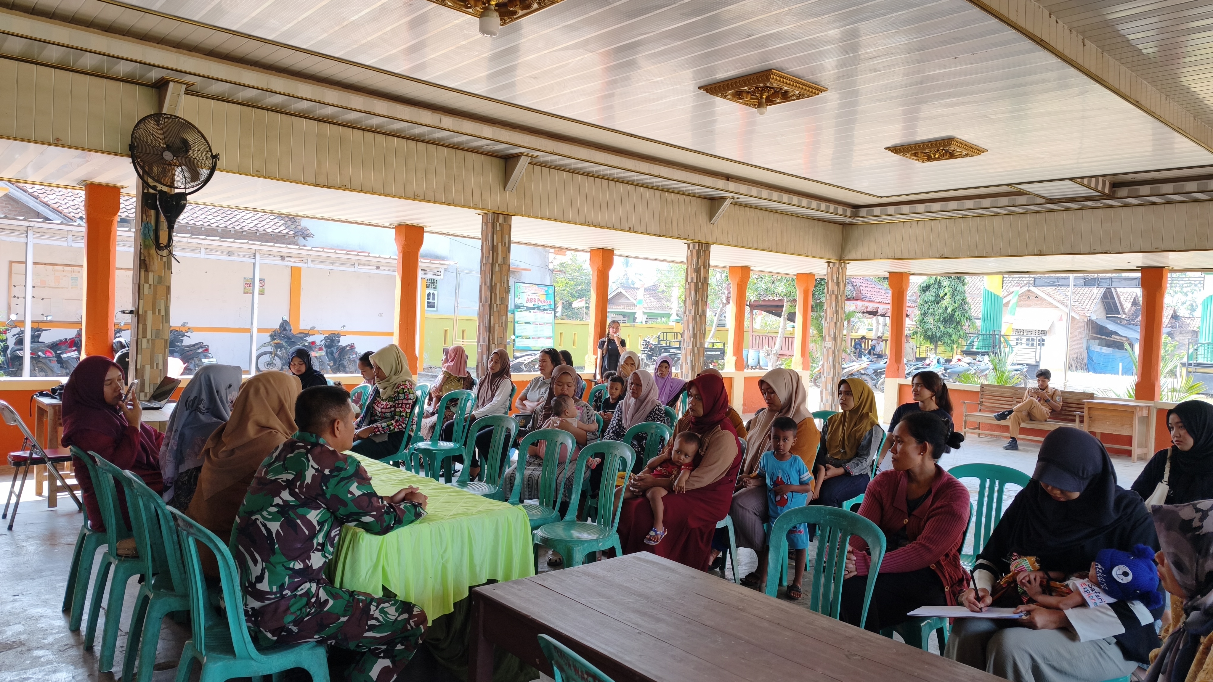 Program Pemberian Makanan Tambahan (PMT) yang diselenggarakan oleh Posyandu.