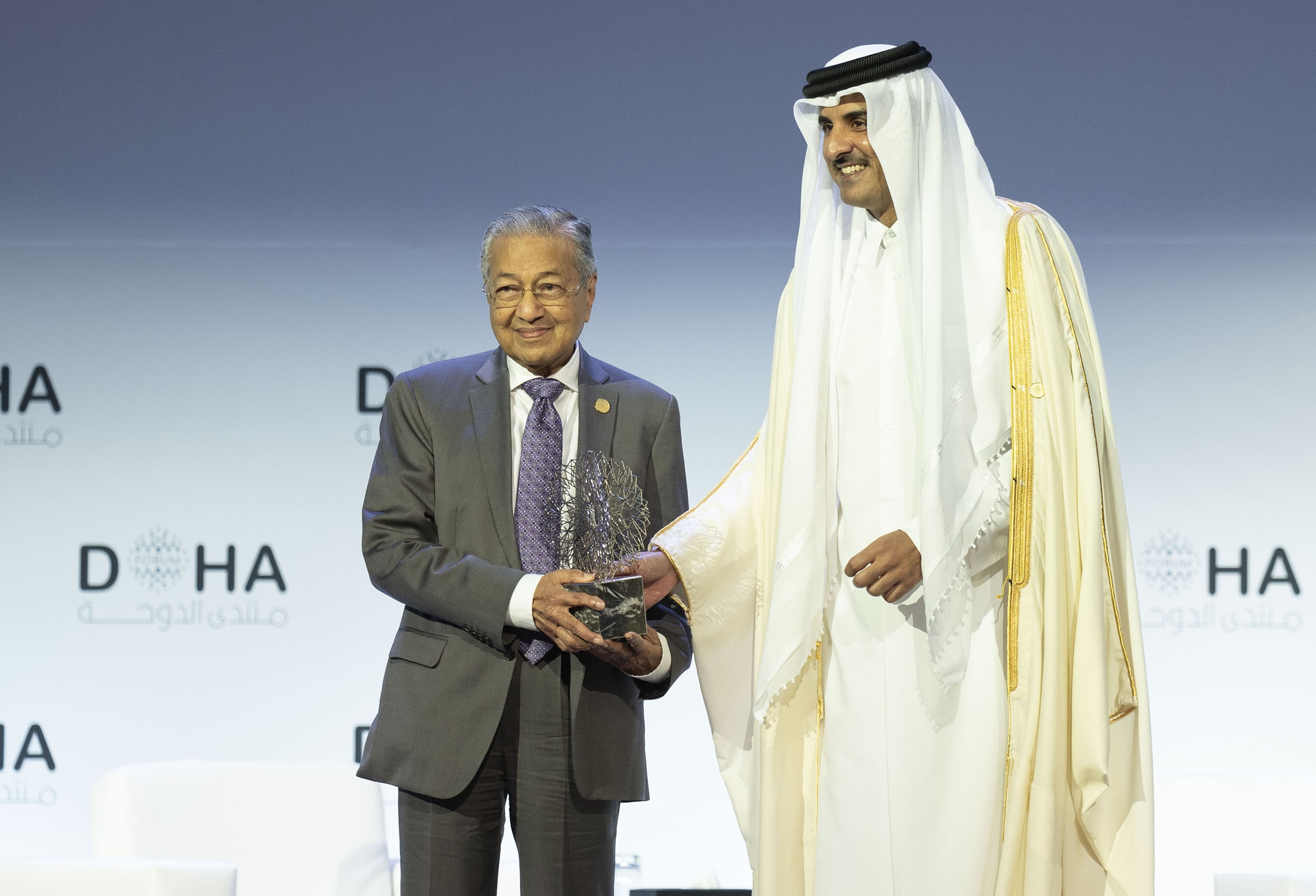 His Highness the Amir Sheikh Tamim bin Hamad Al Thani honored former Malaysian Prime Minister Tun Dr. Mahathir Mohamad in recognition of his lifetime achievements during the opening ceremony of the Doha Forum 2019