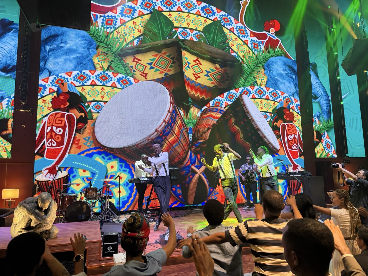 Guests join Ruti Joël in an energetic celebration of Rwandan music, dance, and cultural friendship during the cultural night in Jakarta