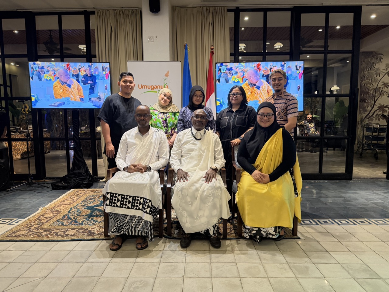 The Rwandan Ambassador and First Counsellor Théophile Rurangwa pose with journalists following the Umuganura reception in Jakarta.