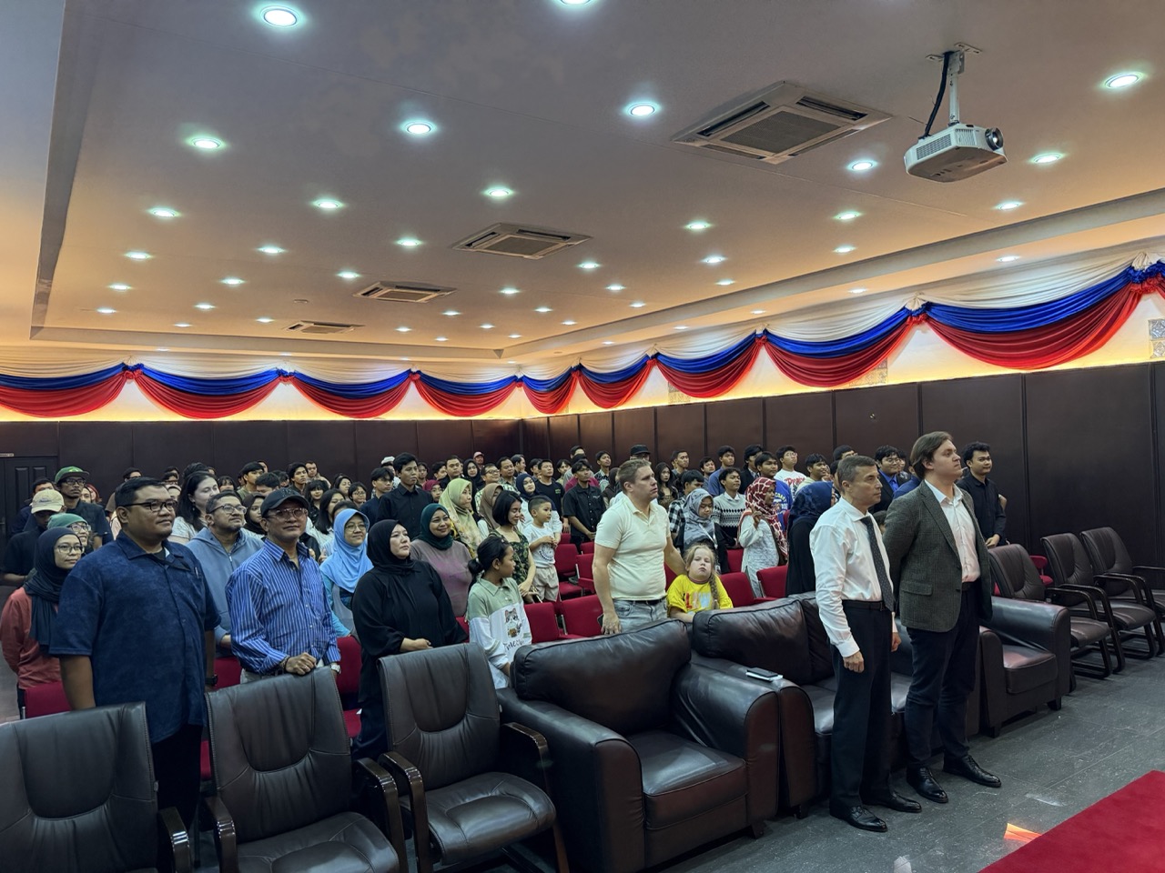 Ambassador Sergei Tolchenov and Russian House Director Nikita Shilikov join the audience at the *Cheburashka 2* screening in Jakarta.