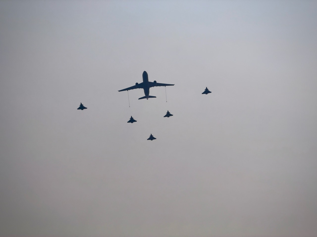 An A330 MRTT tanker leads a formation of Rafale fighters during the PEGASE 2026 joint air exercise over Jakarta.