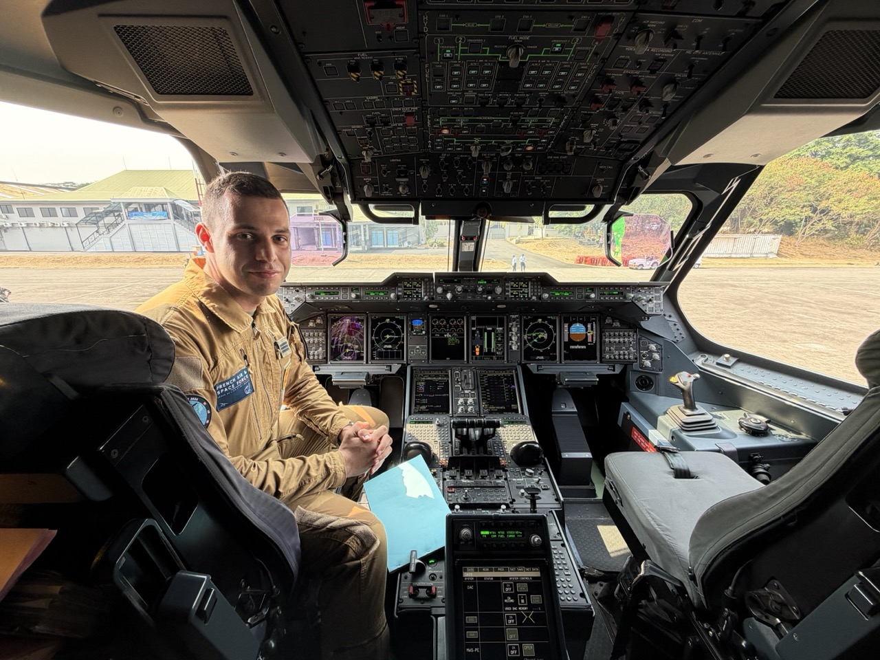 A French Air and Space Force officer sits inside the cockpit of an A400M Atlas during PEGASE 2026 at Halim Perdanakusuma Air Base.