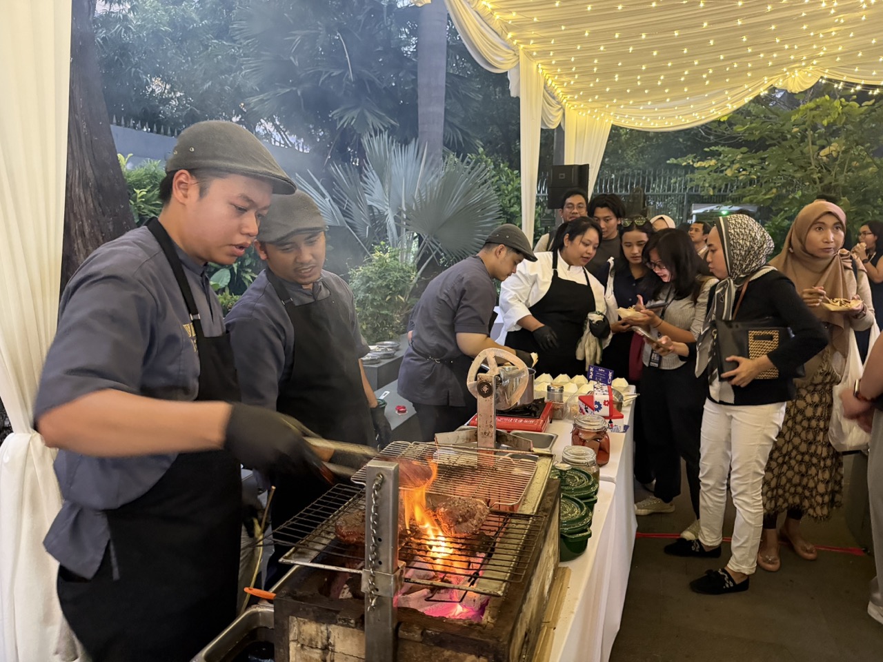 Culinary teams prepare tasting dishes as guests explore the food stations at the opening of Rendez-Vous Rasa 2026.