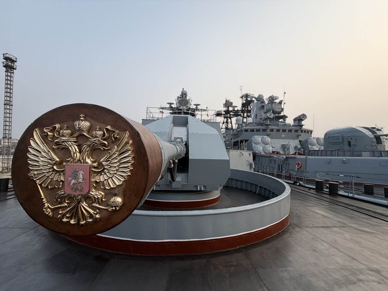 Russia’s coat of arms adorns a naval gun’s muzzle cover during Open Ship Day at Tanjung Priok, Jakarta.