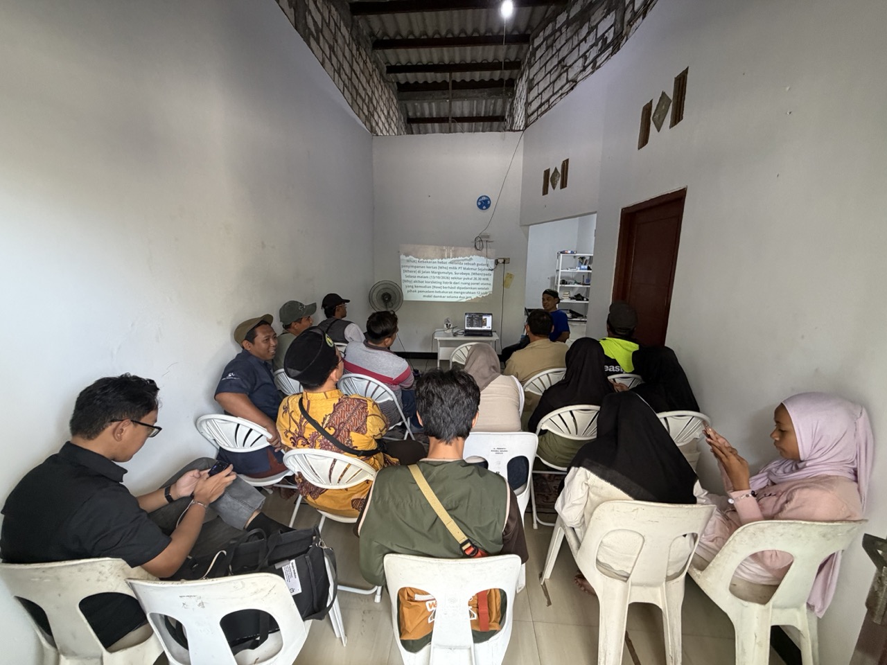 Senior journalist Nanang Purwono leads a news and article-writing workshop during One Community Camp in Leran, Gresik.