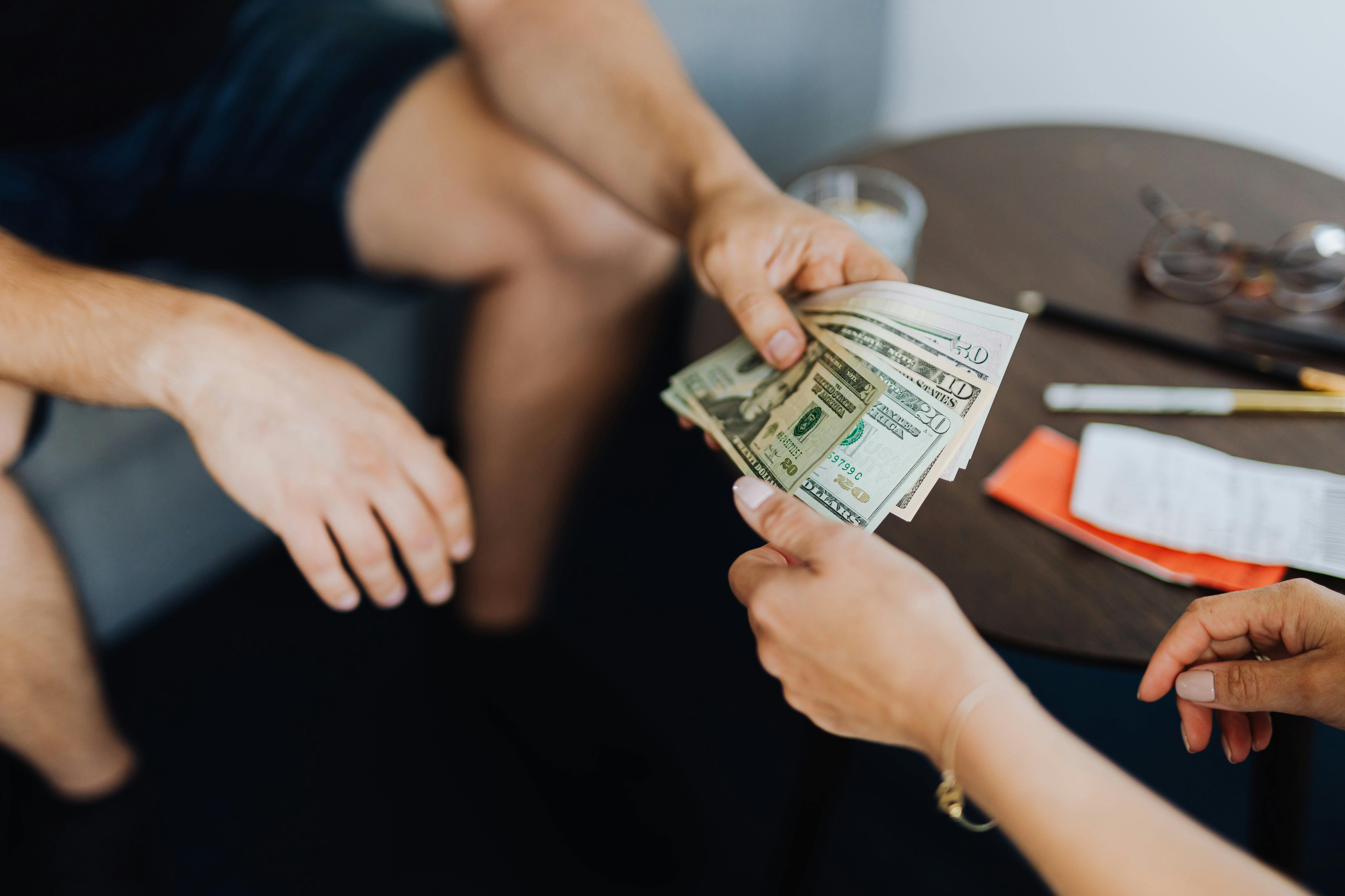 person giving money