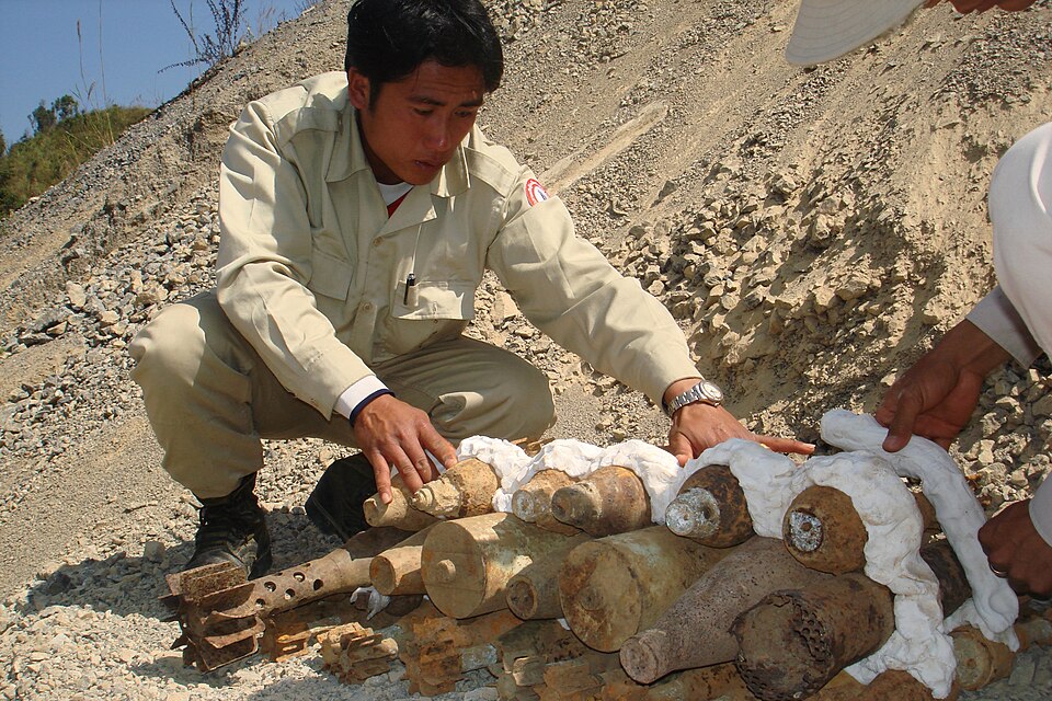 UXO Lao SEOD technition preparing UXO for destruction | Department of Foreign Affairs and Trade