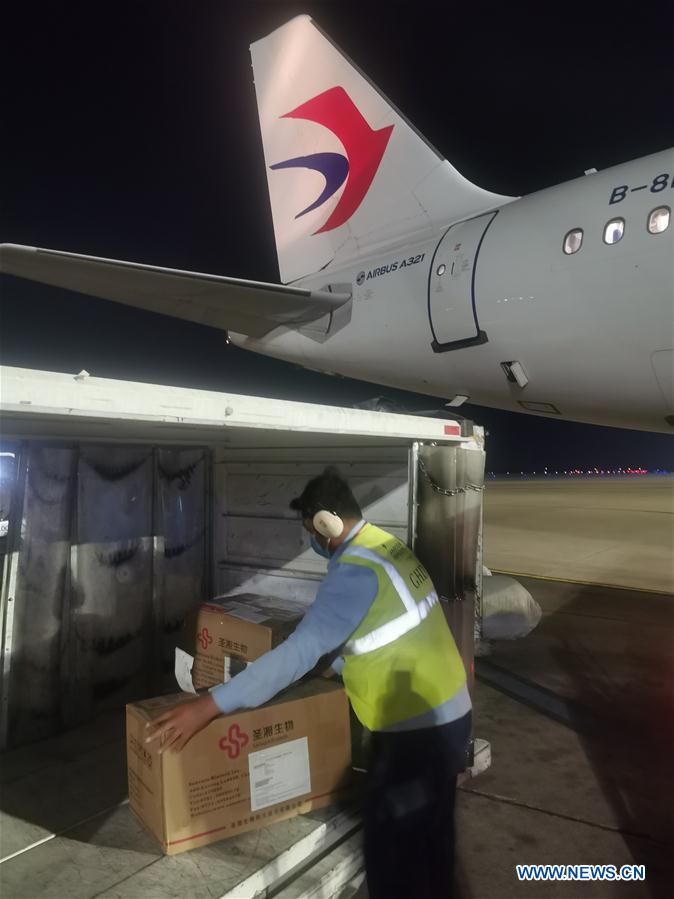 A staff member unloads the fast test kits for COVID-19 donated by China at the Phnom Penh International Airport in Phnom Penh, Cambodia, March 17, 2020. China has donated 2,016 fast test kits for COVID-19 to Cambodia in a bid to help the country fight the virus, Cambodia's Ministry of Health Spokeswoman Or Vandine said here on Wednesday. The items arrived at the Phnom Penh International Airport Tuesday night, she said. Image: China Eastern Airlines Corporation Limited/Handout via Xinhua