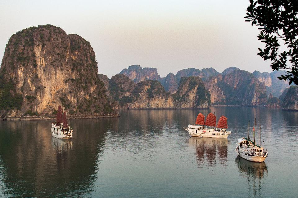 Boats sit in the harbor in Halong Bay, Vietnam. image: Shutterstock