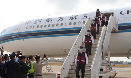 A team of Chinese medical experts arrive at the Phnom Penh International Airport in Phnom Penh, Cambodia, March 23, 2020. Image: Xinhua/Mao Pengfei