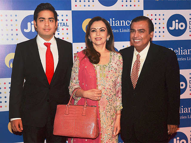 Mukesh Ambani, Chairman, Reliance Industries Ltd. with his wife Nita Ambani and son Akash Ambani arrives for the company's annual general meeting in Mumbai. Image: India Times