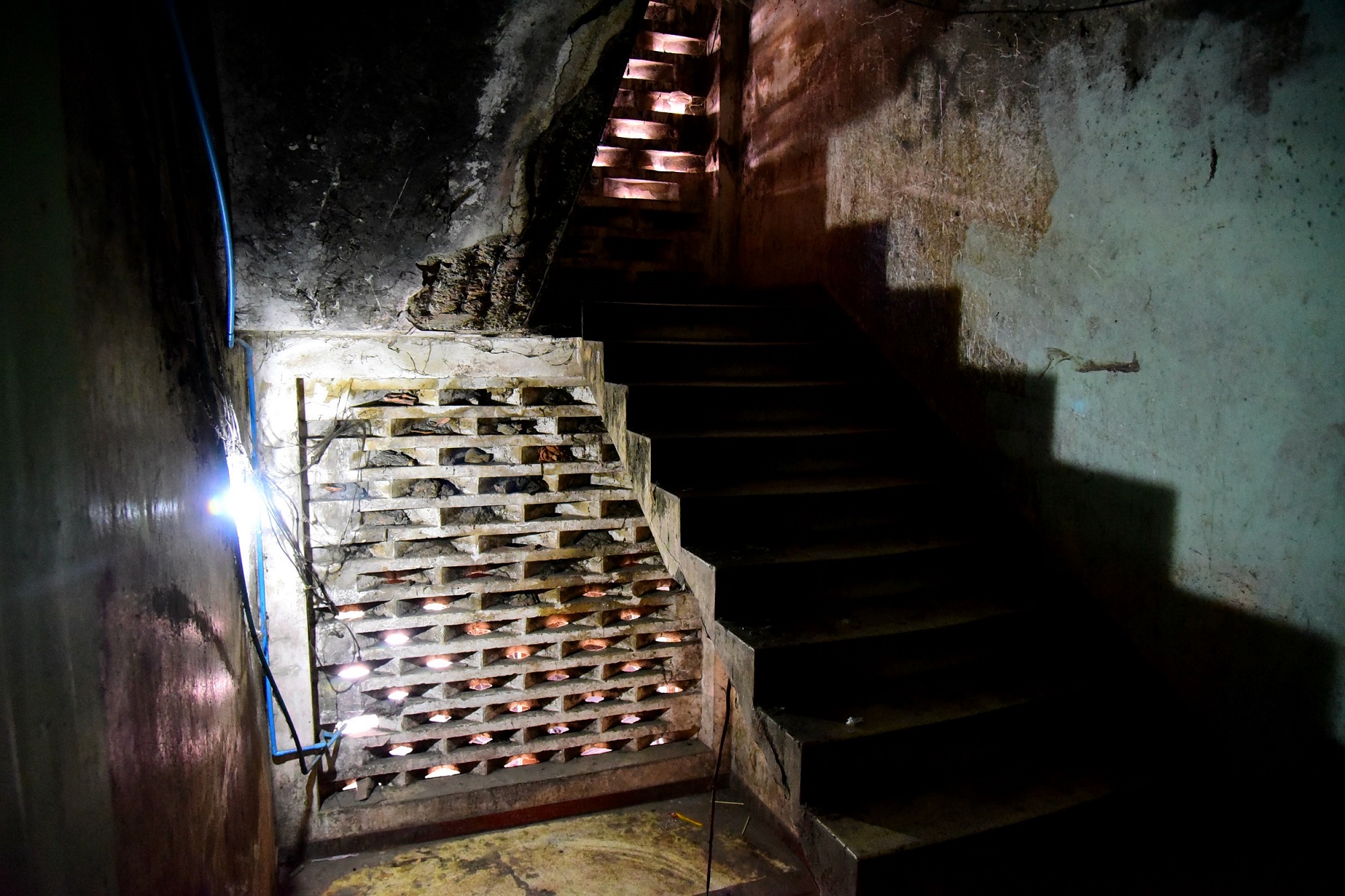 A decrepit staircase inside the White Building.